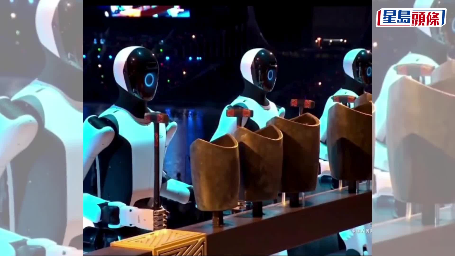 全運會開幕式，機械人用青銅句鑃奏樂。 新華社